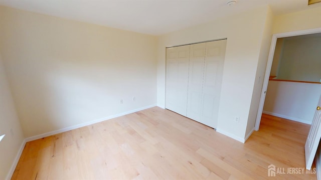 53 Kirschman Dr, Old Bridge, NJ 07747 - unfurnished bedroom with light wood-style floors and a closet