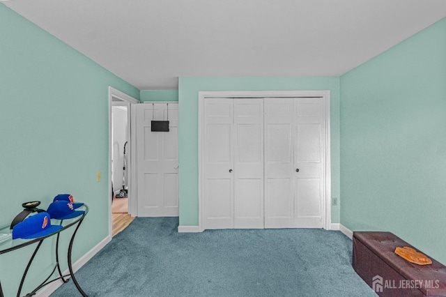 bedroom with carpet floors and a closet