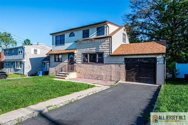 view of front property featuring cooling unit, a garage, and a front yard