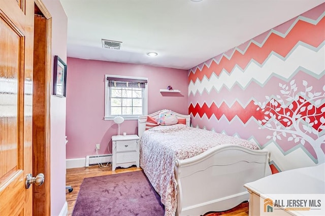 6 Mockingbird Rd, Edison, NJ 08820 - bedroom featuring a baseboard radiator, wood finished floors, and baseboards