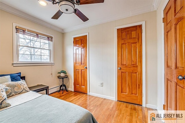 6 Mockingbird Rd, Edison, NJ 08820 - bedroom with baseboard heating, light wood finished floors, crown molding, baseboards, and a ceiling fan