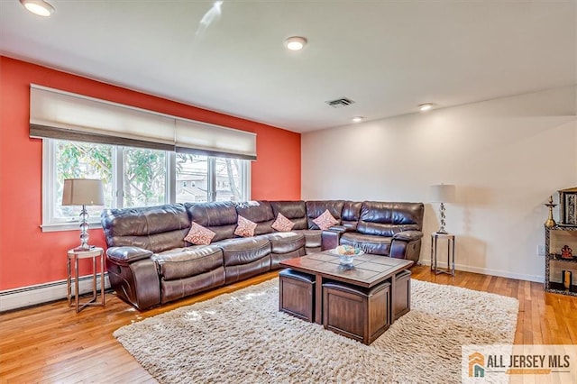 6 Mockingbird Rd, Edison, NJ 08820 - living room with baseboard heating, light wood-style floors, recessed lighting, and baseboards