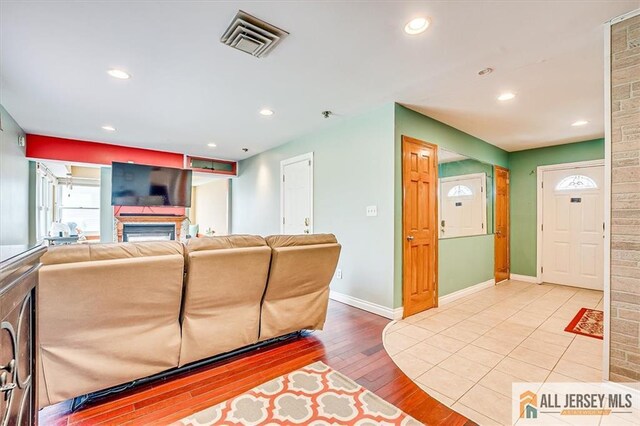 6 Mockingbird Rd, Edison, NJ 08820 - living area with baseboards, hardwood / wood-style flooring, recessed lighting, and a glass covered fireplace