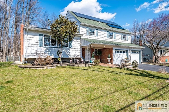 6 Mockingbird Rd, Edison, NJ 08820 - view of front of house featuring driveway, a garage, solar panels, and a front lawn