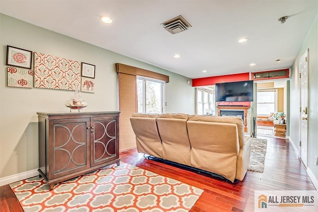 6 Mockingbird Rd, Edison, NJ 08820 - living area featuring wood finished floors, a glass covered fireplace, baseboards, and recessed lighting