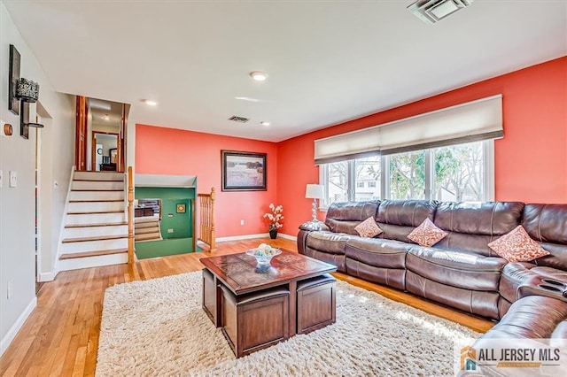 6 Mockingbird Rd, Edison, NJ 08820 - living area with light wood-type flooring, stairs, baseboards, and recessed lighting