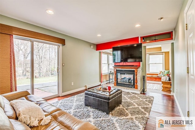 6 Mockingbird Rd, Edison, NJ 08820 - living area with wood finished floors, baseboards, a glass covered fireplace, and recessed lighting