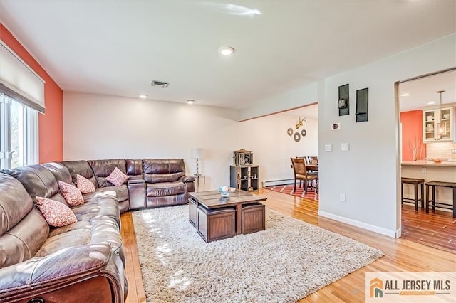 6 Mockingbird Rd, Edison, NJ 08820 - living area with baseboard heating, light wood-style floors, recessed lighting, and baseboards