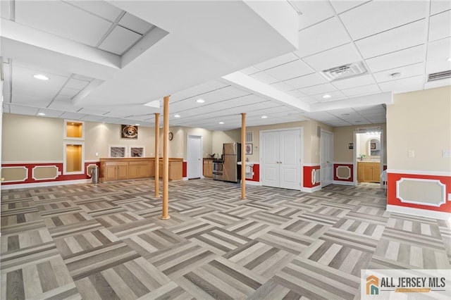 482 Spotswood Gravel Hill Rd, Monroe, NJ 08831 - finished basement with light colored carpet, freestanding refrigerator, wainscoting, and recessed lighting