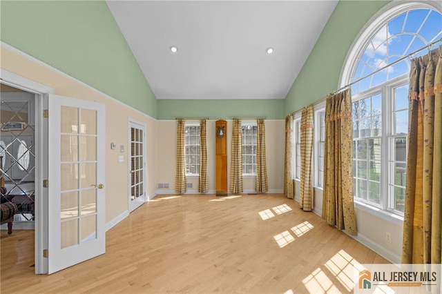 482 Spotswood Gravel Hill Rd, Monroe, NJ 08831 - unfurnished sunroom with high vaulted ceiling, wood finished floors, baseboards, french doors, and recessed lighting