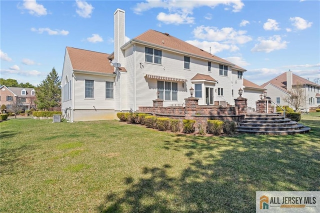482 Spotswood Gravel Hill Rd, Monroe, NJ 08831 - rear view of property featuring a chimney and a lawn