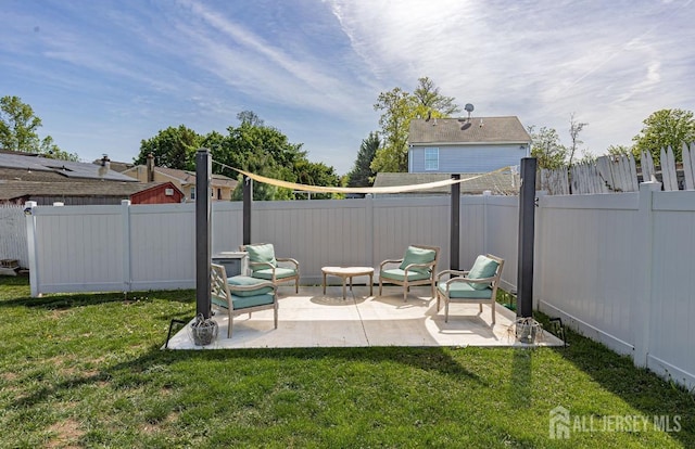 view of yard featuring a patio and a fenced backyard