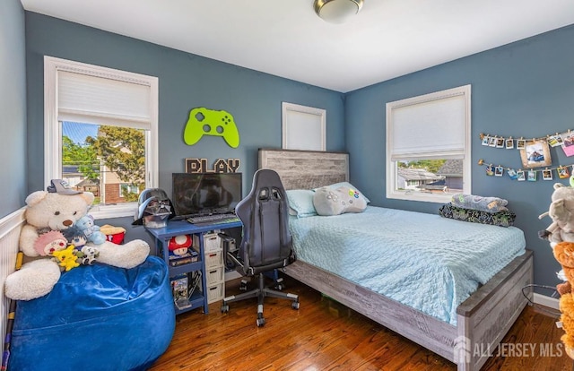 bedroom with wood finished floors