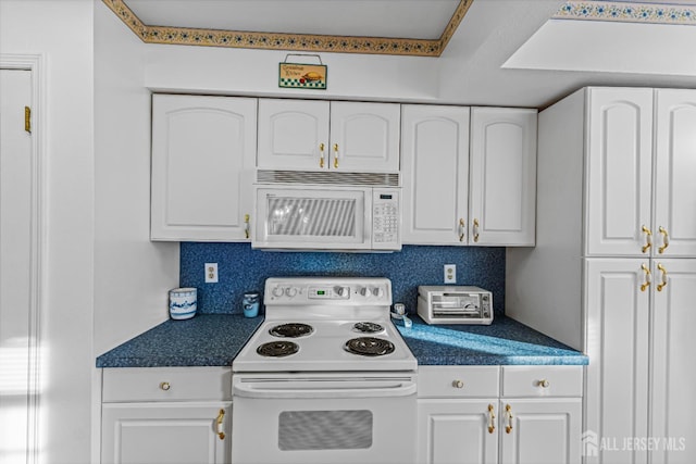 kitchen featuring white cabinetry, white appliances, and backsplash