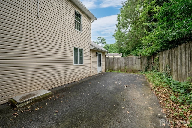 439 Old Main St, Franklin, NJ 08802 - view of home's exterior with a fenced backyard, a patio, and driveway