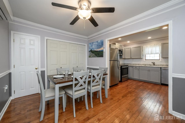 439 Old Main St, Franklin, NJ 08802 - dining room featuring a wall unit AC, dark wood-style floors, a ceiling fan, and crown molding