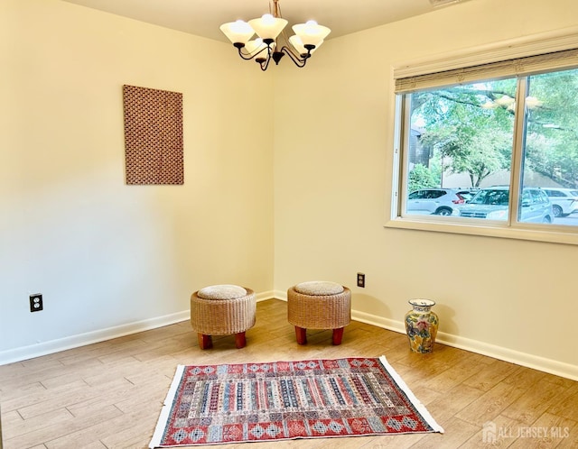 4424 Sayre Dr, Plainsboro, NJ 08540 - sitting room featuring a chandelier, wood finished floors, and baseboards
