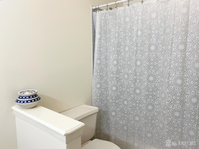 4424 Sayre Dr, Plainsboro, NJ 08540 - full bathroom with toilet and a shower with shower curtain