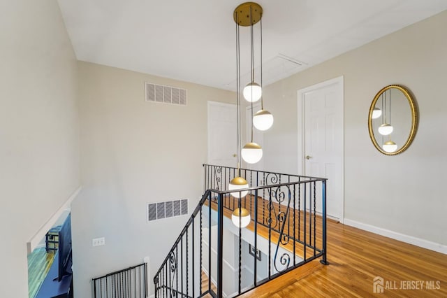 35 Poet Dr, Matawan, NJ 07747 - staircase with attic access and wood finished floors