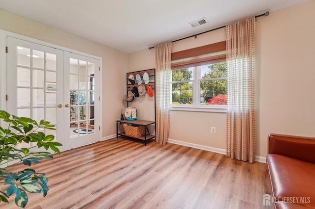 35 Poet Dr, Matawan, NJ 07747 - doorway with light wood-style floors, plenty of natural light, and french doors