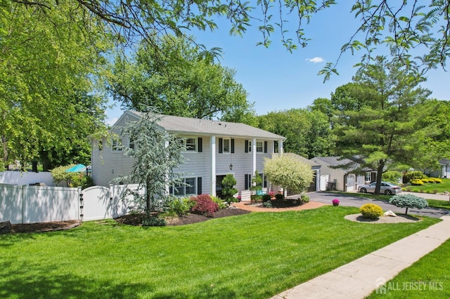 35 Poet Dr, Matawan, NJ 07747 - greek revival house featuring a gate and a garage
