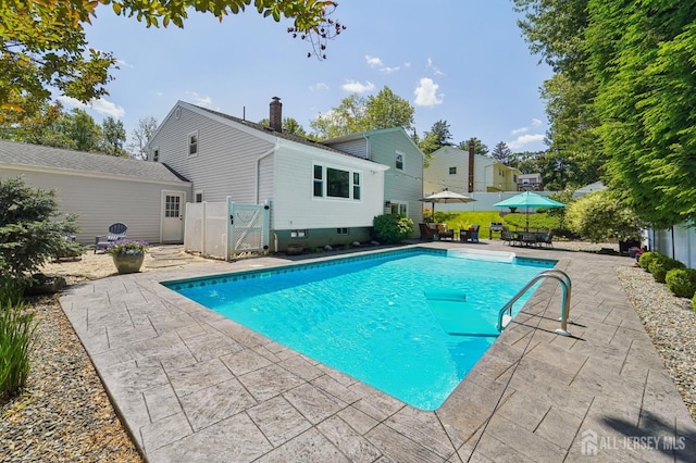 35 Poet Dr, Matawan, NJ 07747 - outdoor pool with a patio area and a gate