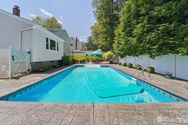35 Poet Dr, Matawan, NJ 07747 - outdoor pool featuring a fenced backyard and a patio