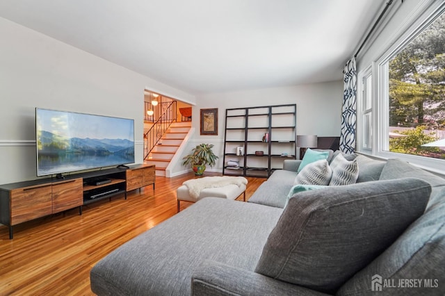 35 Poet Dr, Matawan, NJ 07747 - living room with healthy amount of natural light, stairs, and wood finished floors