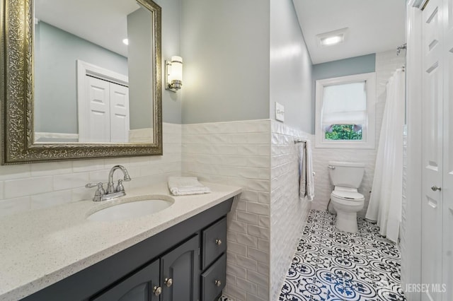 35 Poet Dr, Matawan, NJ 07747 - full bathroom with tile walls, vanity, curtained shower, and wainscoting