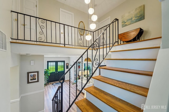 35 Poet Dr, Matawan, NJ 07747 - stairway with wood finished floors, french doors, and a high ceiling