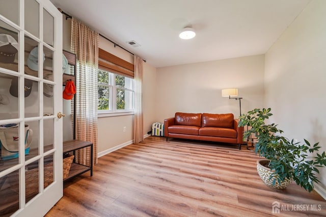 35 Poet Dr, Matawan, NJ 07747 - sitting room with wood finished floors and baseboards