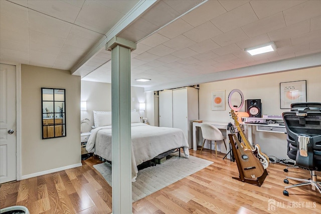 1072 Salem Ave, Hillside, NJ 07205 - bedroom with wood finished floors, an office area, and decorative columns
