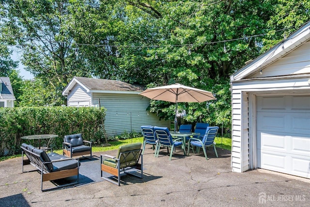 1072 Salem Ave, Hillside, NJ 07205 - view of patio featuring an outdoor structure, outdoor dining space, and outdoor lounge area