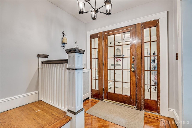 1072 Salem Ave, Hillside, NJ 07205 - foyer entrance with wood finished floors, baseboard heating, and a chandelier