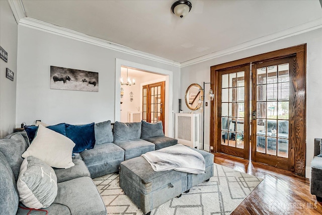 1072 Salem Ave, Hillside, NJ 07205 - living area featuring french doors, crown molding, wood-type flooring, and a chandelier