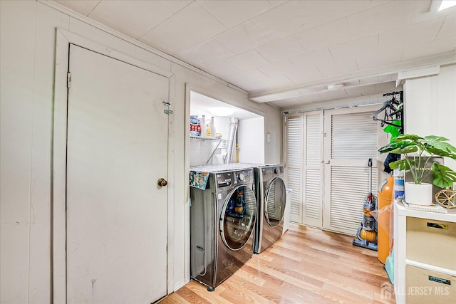 1072 Salem Ave, Hillside, NJ 07205 - laundry area featuring washing machine and clothes dryer and light wood-style floors