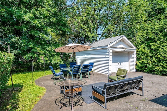 1072 Salem Ave, Hillside, NJ 07205 - view of patio / terrace featuring an outbuilding and a garage