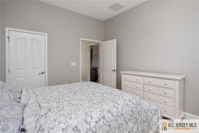 bedroom featuring visible vents