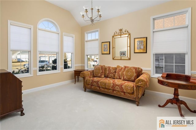 living area with lofted ceiling, light carpet, and a notable chandelier