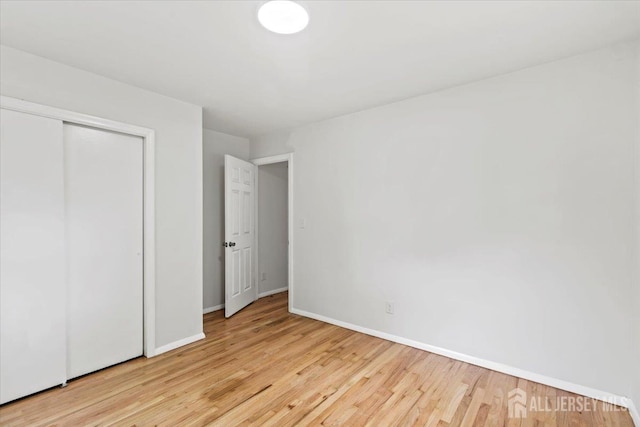 376 New Brunswick Ave, East Brunswick, NJ 08816 - unfurnished bedroom featuring wood finished floors and a closet
