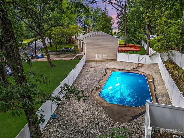 376 New Brunswick Ave, East Brunswick, NJ 08816 - pool at dusk with a fenced backyard