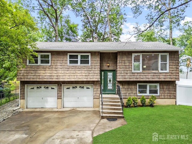 376 New Brunswick Ave, East Brunswick, NJ 08816 - bi-level home with concrete driveway, a garage, a front yard, roof with shingles, and a chimney