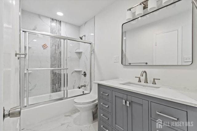 376 New Brunswick Ave, East Brunswick, NJ 08816 - full bathroom featuring vanity, marble look tiles, shower / bath combination with glass door, and recessed lighting