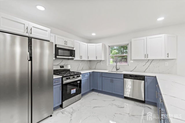 376 New Brunswick Ave, East Brunswick, NJ 08816 - kitchen featuring stainless steel appliances, light marble finish flooring, white cabinets, tasteful backsplash, and recessed lighting