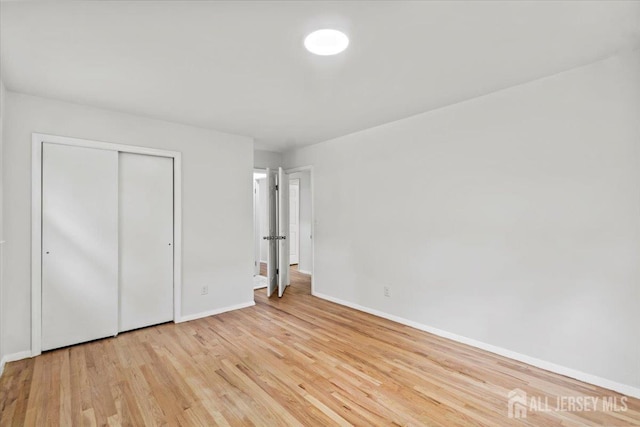 376 New Brunswick Ave, East Brunswick, NJ 08816 - unfurnished bedroom with light wood-type flooring and a closet