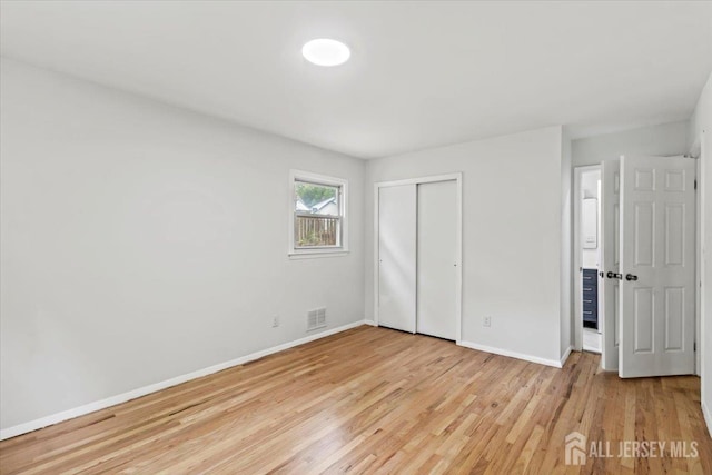 376 New Brunswick Ave, East Brunswick, NJ 08816 - unfurnished bedroom with light wood-type flooring and a closet