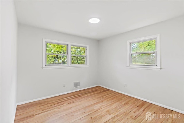 376 New Brunswick Ave, East Brunswick, NJ 08816 - unfurnished room with plenty of natural light and wood finished floors