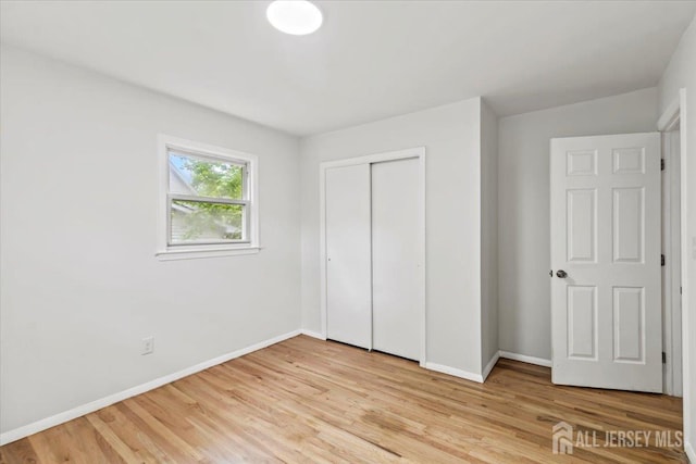 376 New Brunswick Ave, East Brunswick, NJ 08816 - unfurnished bedroom featuring light wood-style floors and a closet