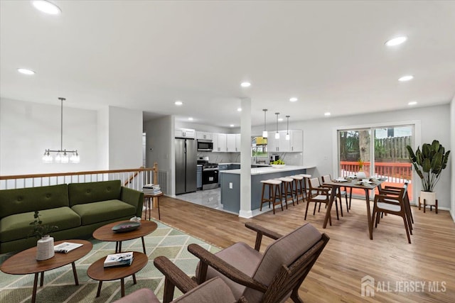 376 New Brunswick Ave, East Brunswick, NJ 08816 - living area with light wood finished floors, recessed lighting, and a chandelier