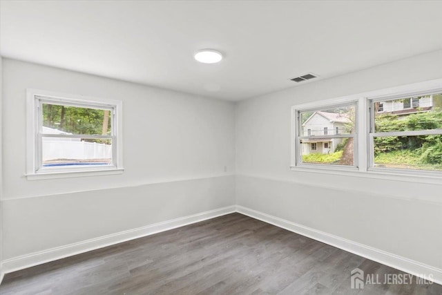376 New Brunswick Ave, East Brunswick, NJ 08816 - empty room with dark wood finished floors and baseboards